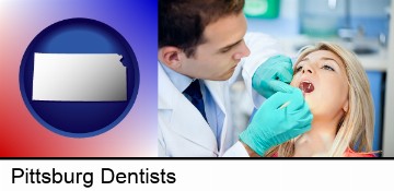 a dentist examining teeth in Pittsburg, KS