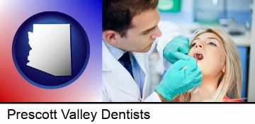 a dentist examining teeth in Prescott Valley, AZ