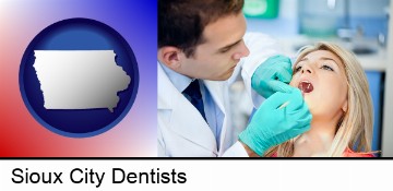 a dentist examining teeth in Sioux City, IA
