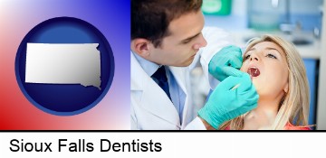 a dentist examining teeth in Sioux Falls, SD