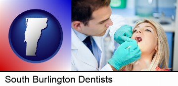a dentist examining teeth in South Burlington, VT