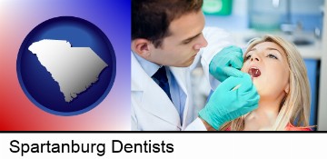 a dentist examining teeth in Spartanburg, SC